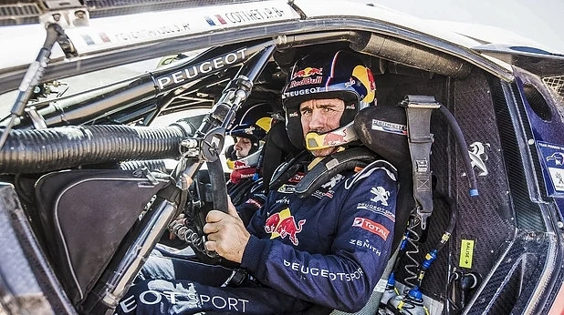 Петерханзел с Peugeot води на рали \
